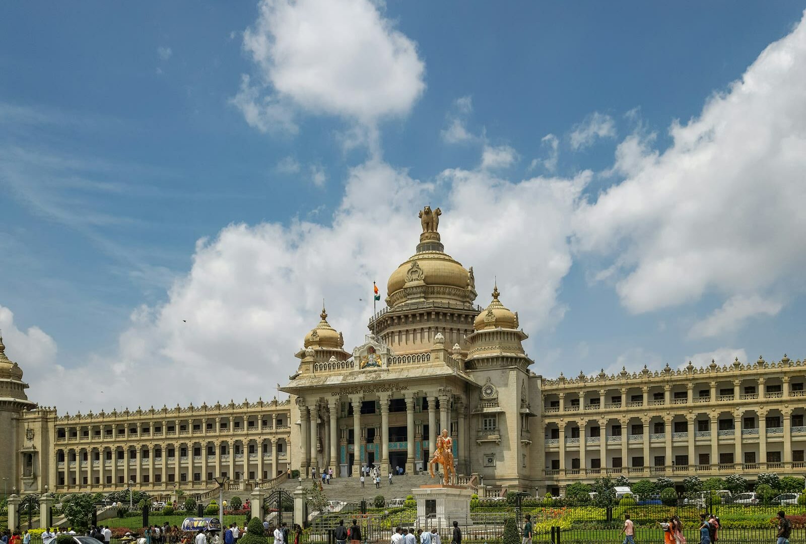 Modern Bangalore cityscape with high-rise buildings and busy urban streets under clear sky