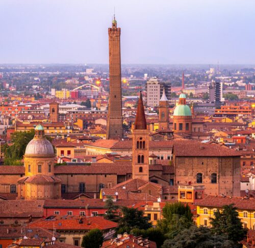 Panoramic view of Bologna red terracotta rooftops and historic towers in Italy