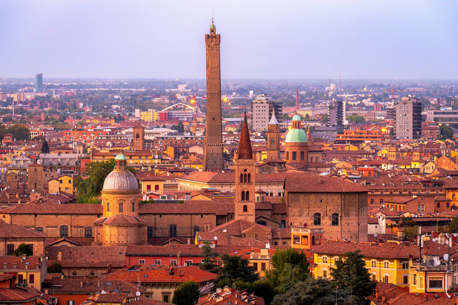 Panoramic view of Bologna red terracotta rooftops and historic towers in Italy