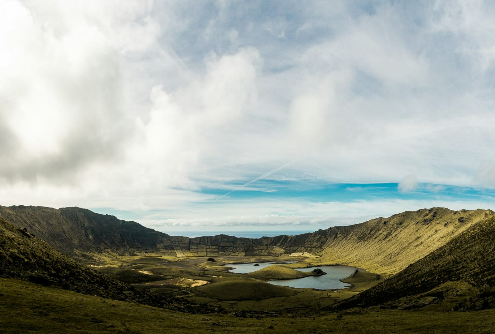 Crater lake near green hills on Corvo island, Azores, Portugal