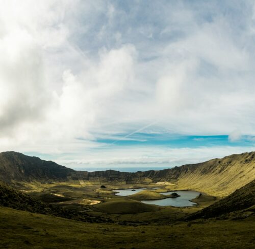 Crater lake near green hills on Corvo island, Azores, Portugal