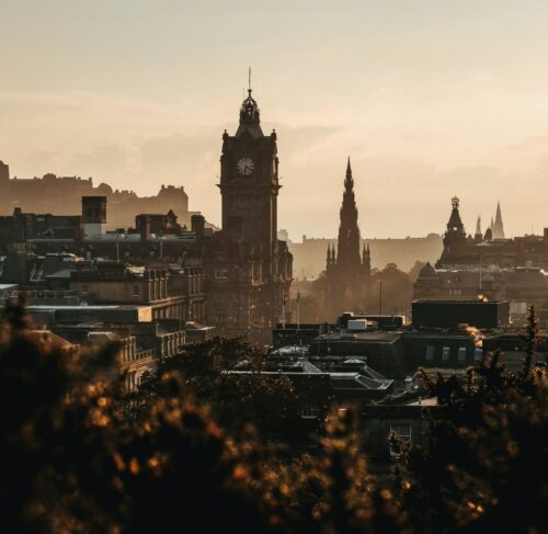 Calton Hill monument and Edinburgh city skyline with historic Old Town buildings in Scotland