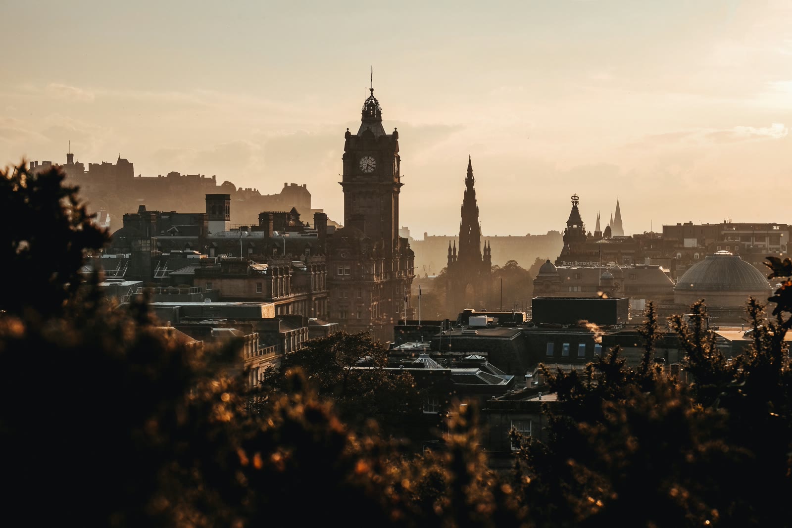 Calton Hill monument and Edinburgh city skyline with historic Old Town buildings in Scotland