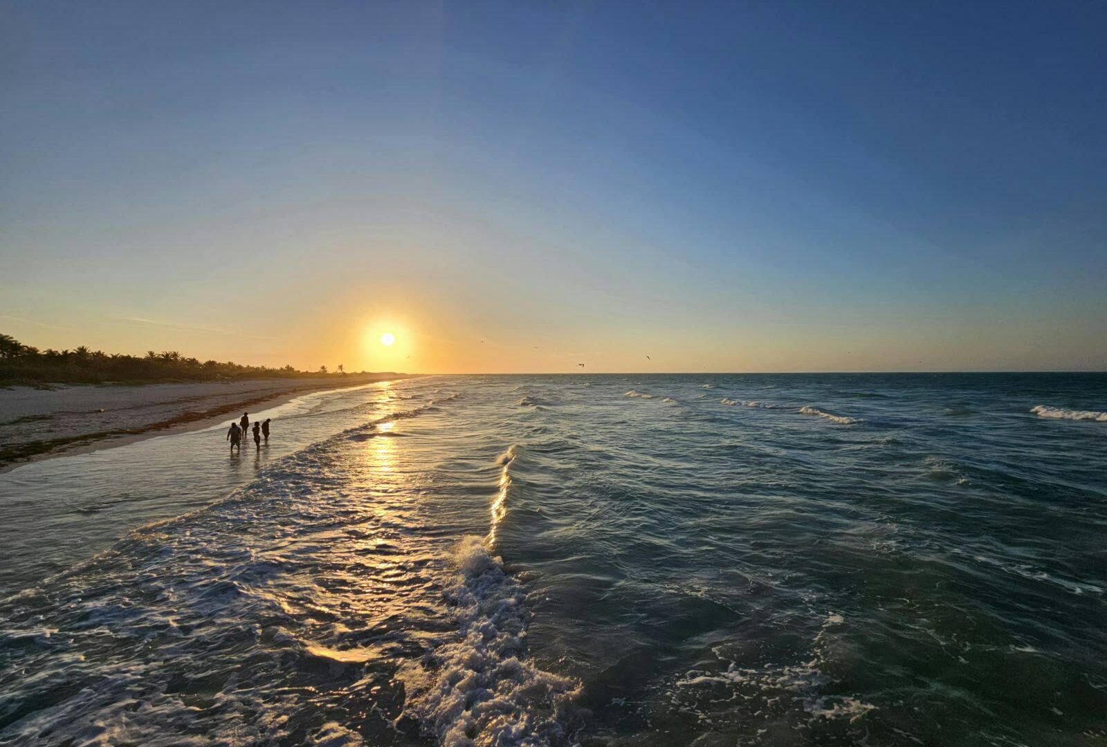 Sunset over the tranquil beach at El Cuyo, Yucatán