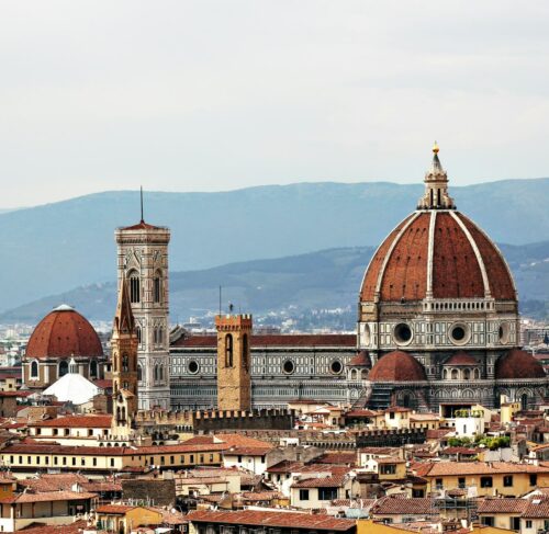 Florence Duomo Cathedral with white and brown concrete dome during daytime Italy