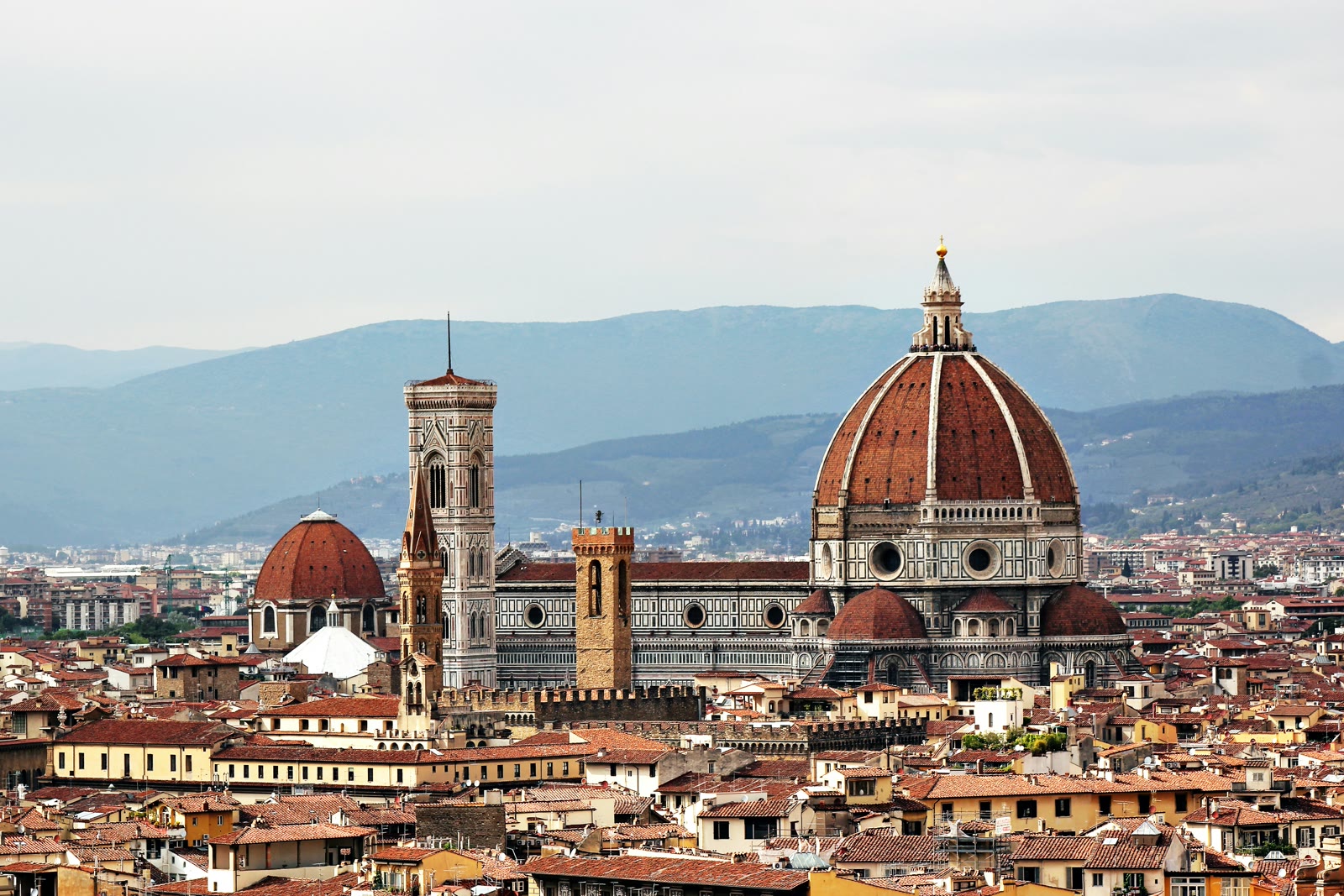 Florence Duomo Cathedral with white and brown concrete dome during daytime Italy