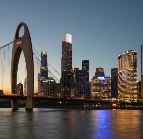 Guangzhou skyline at night with illuminated Canton Tower and city lights reflecting on the Pearl River