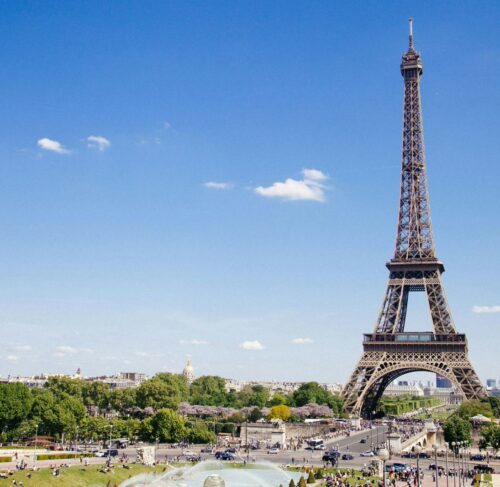 Eiffel Tower in Paris, France against a bright sky