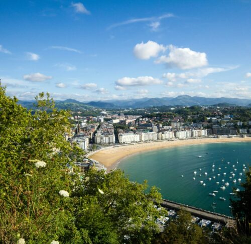 La Concha Bay and Ondarreta Beach with San Sebastian city skyline and Monte Urgull in distance