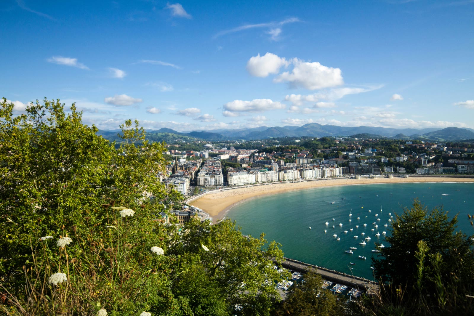 La Concha Bay and Ondarreta Beach with San Sebastian city skyline and Monte Urgull in distance