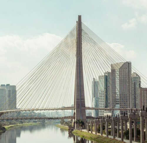 Estaiada Bridge over Pinheiros River with São Paulo city skyline at dusk