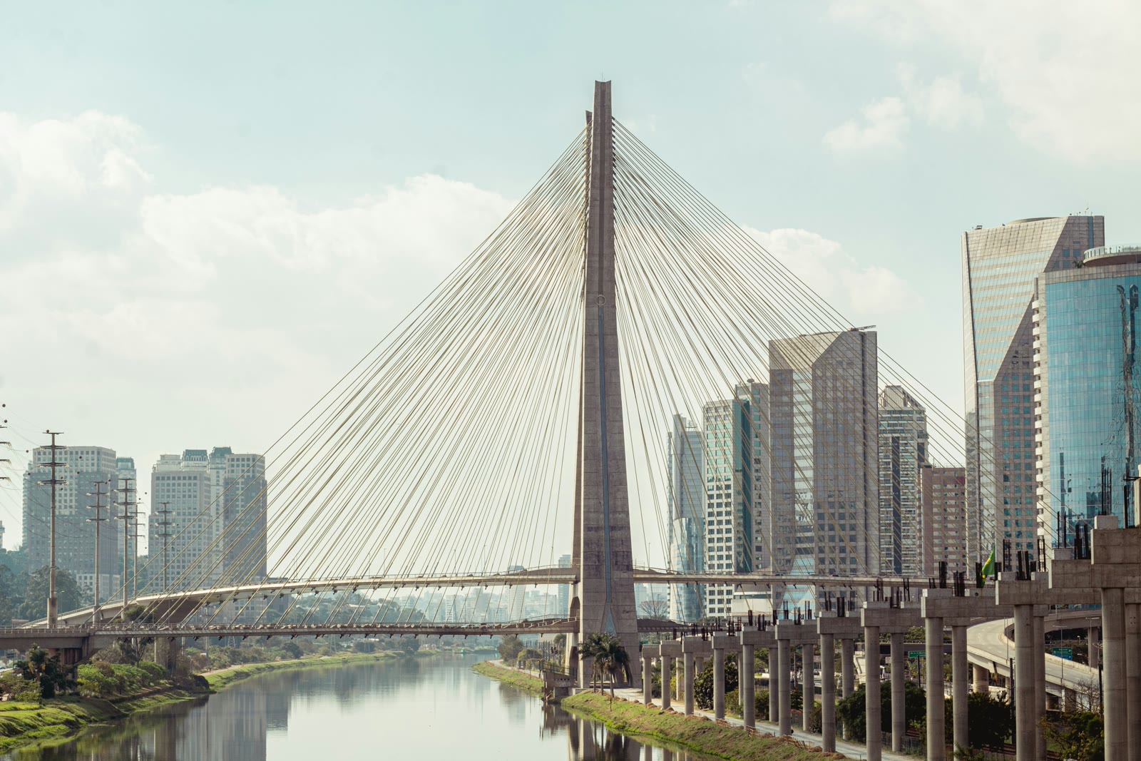 Estaiada Bridge over Pinheiros River with São Paulo city skyline at dusk