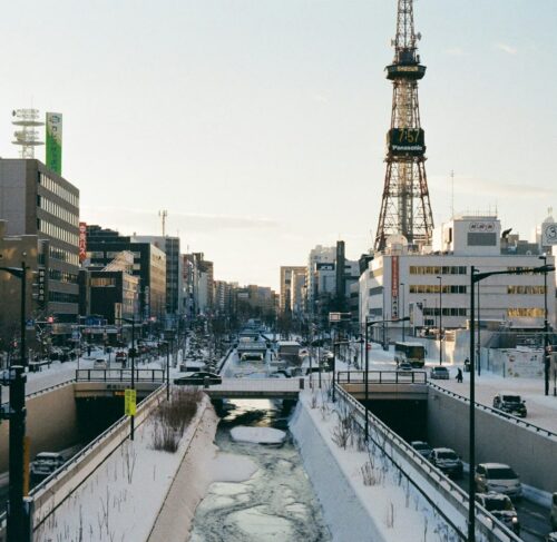 White and black ferry boat docked at Sapporo harbor pier in Hokkaido Japan