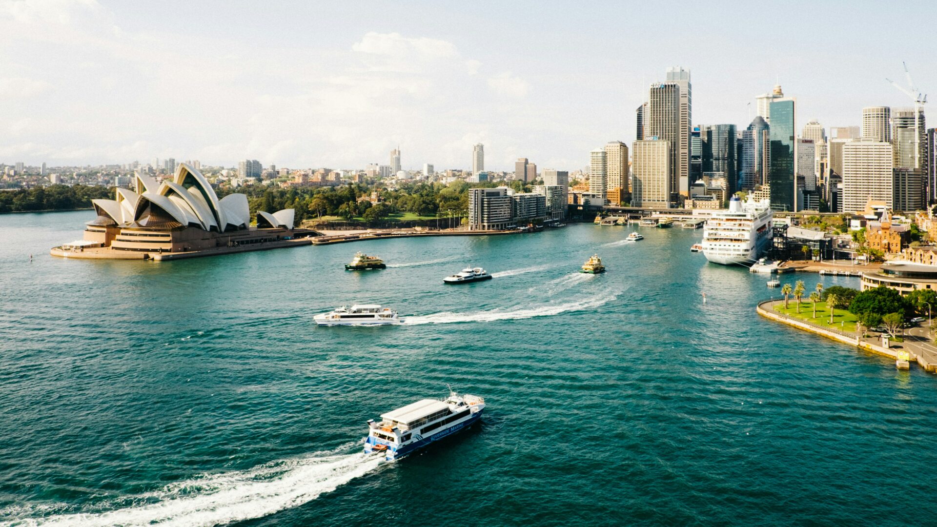 Sydney Opera House and Harbour Bridge during daytime with blue sky