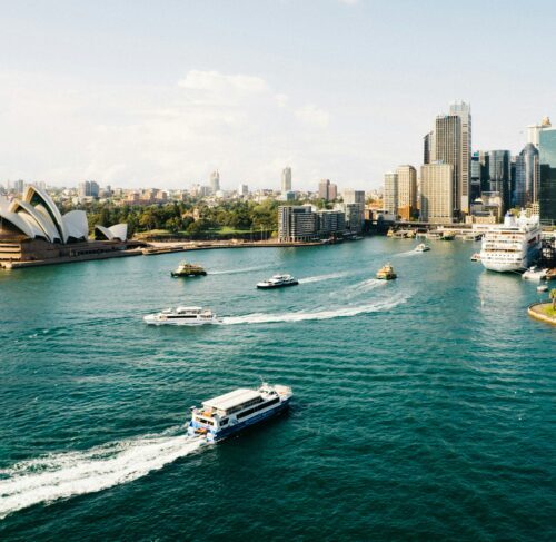 Sydney Opera House and Harbour Bridge during daytime with blue sky
