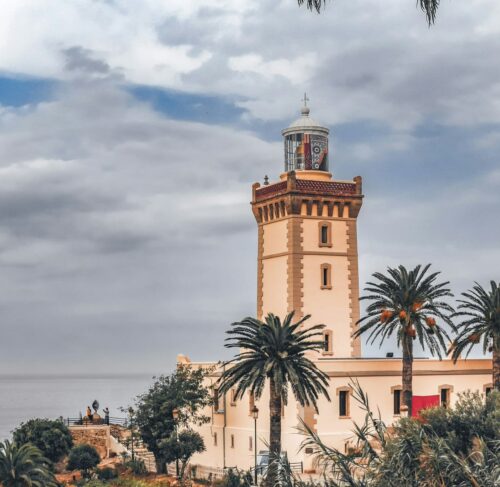 Historic clock tower landmark in Tangier Morocco with traditional architecture against blue sky, North Africa