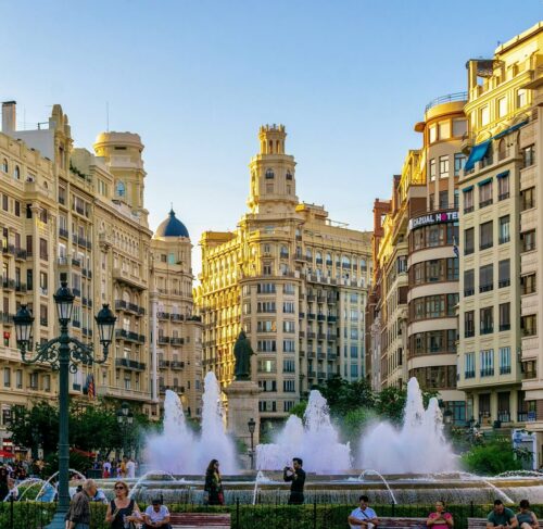 City of Arts and Sciences with people around the fountain in Valencia Spain