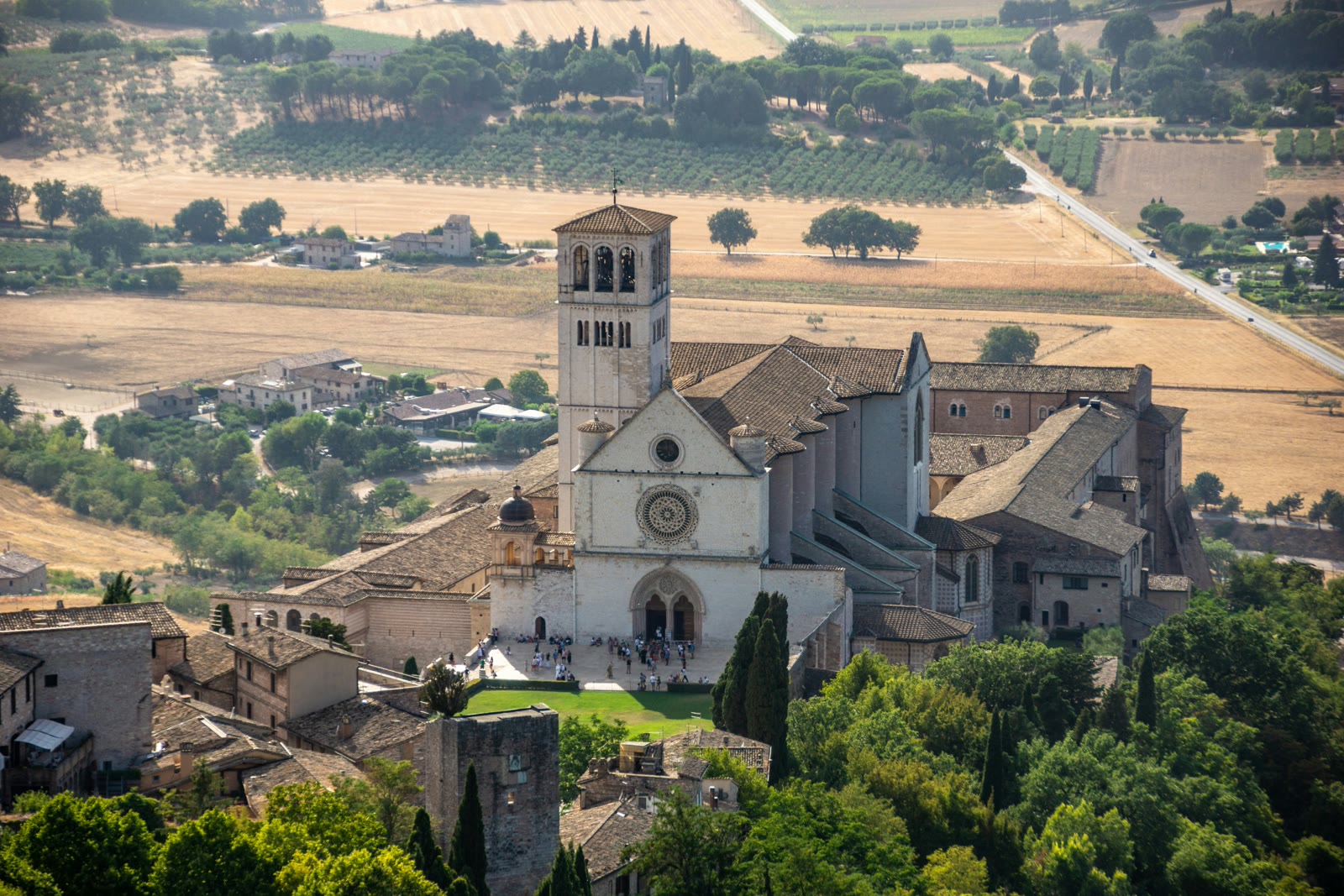White and brown stone building in Assisi, Umbria, Italy