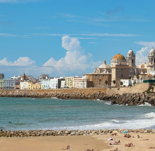 Beach and cityscape of Cadiz with waterfront buildings, Andalusia, Spain
