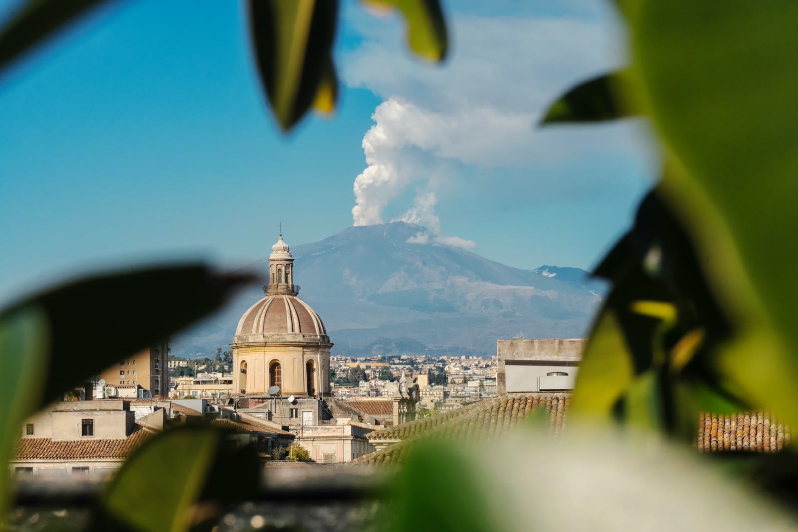 View of Catania city with Mount Etna volcano in the background, Sicily, Italy