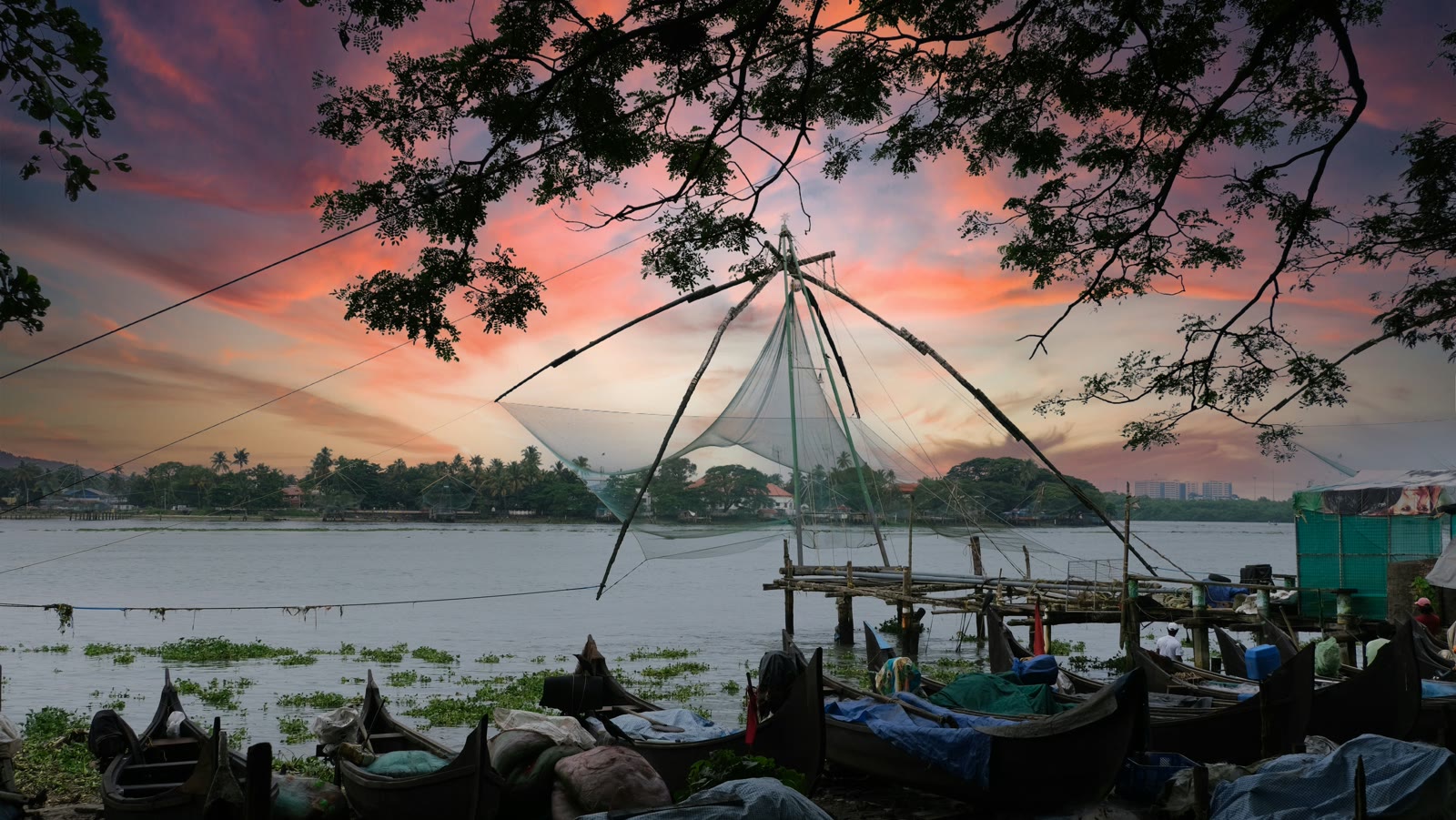 Fishing boats at sunset in Kochi harbor, Kerala, India