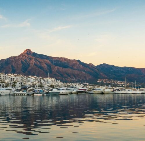 White boats on the sea with mountains in the background, Marbella, Andalusia, Spain