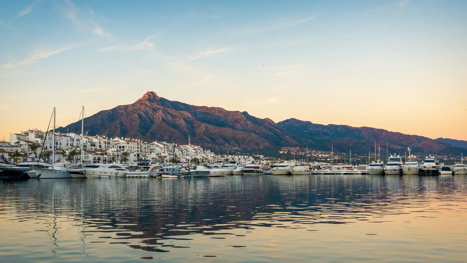 White boats on the sea with mountains in the background, Marbella, Andalusia, Spain