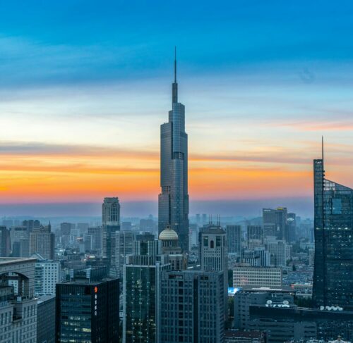 Nanjing city skyline at sunset viewed from a high-rise building, Jiangsu, China