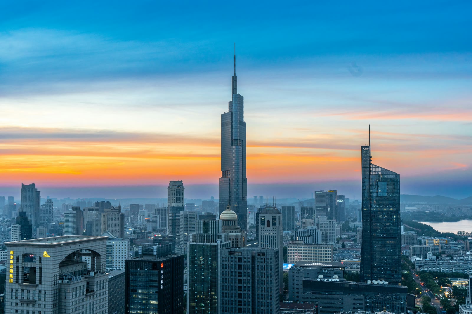 Nanjing city skyline at sunset viewed from a high-rise building, Jiangsu, China