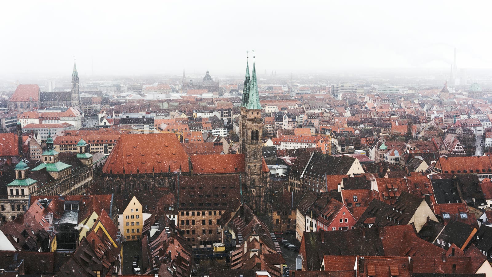 Aerial view of red-roofed houses and historic buildings in Nuremberg during daytime, Bavaria, Germany