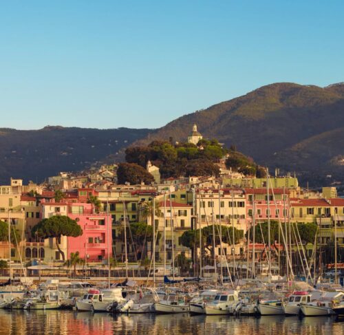 Harbor full of boats with mountains behind, Sanremo, Liguria, Italy