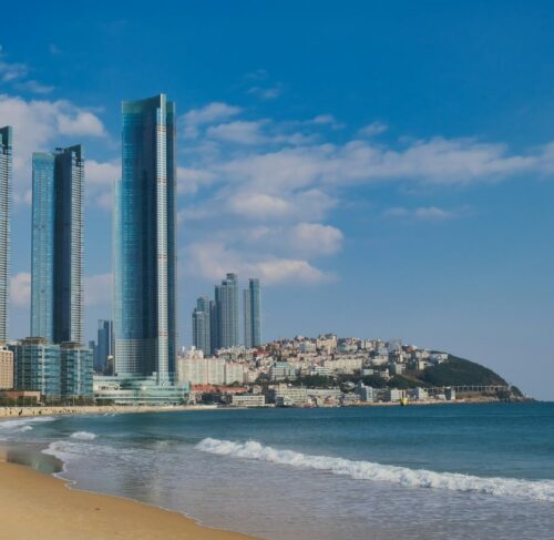 Beach with high-rise buildings skyline in Busan, South Korea