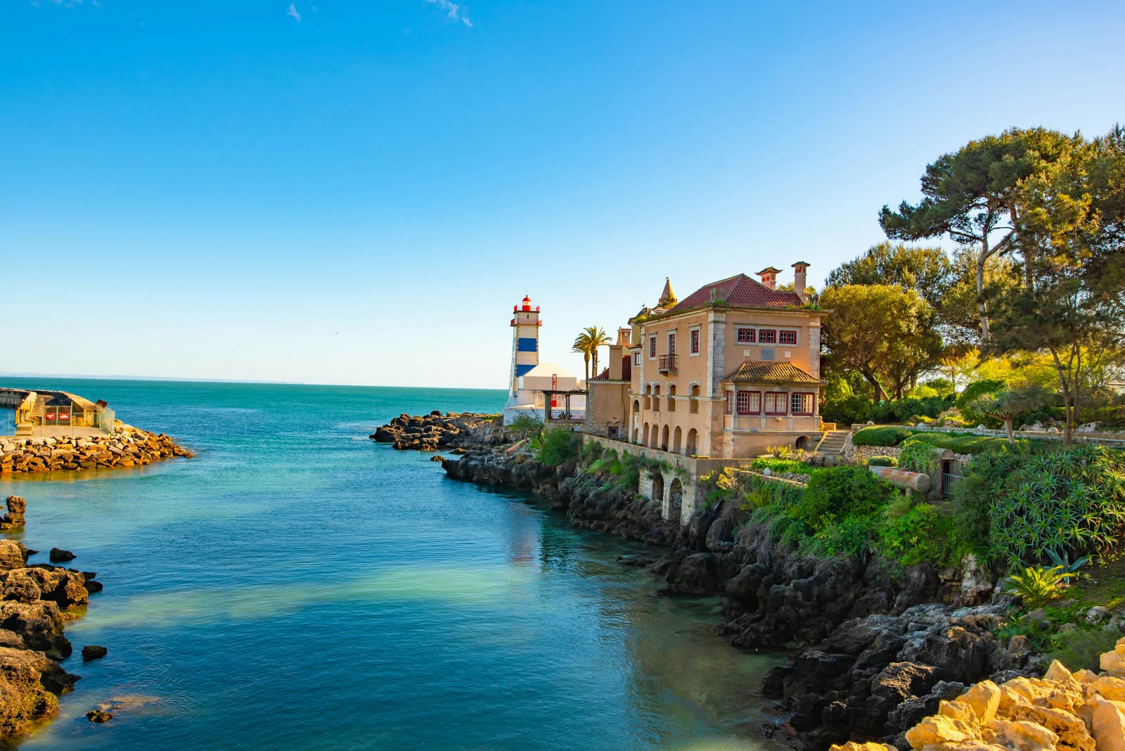 White and brown building by the water in Cascais, Lisbon, Portugal