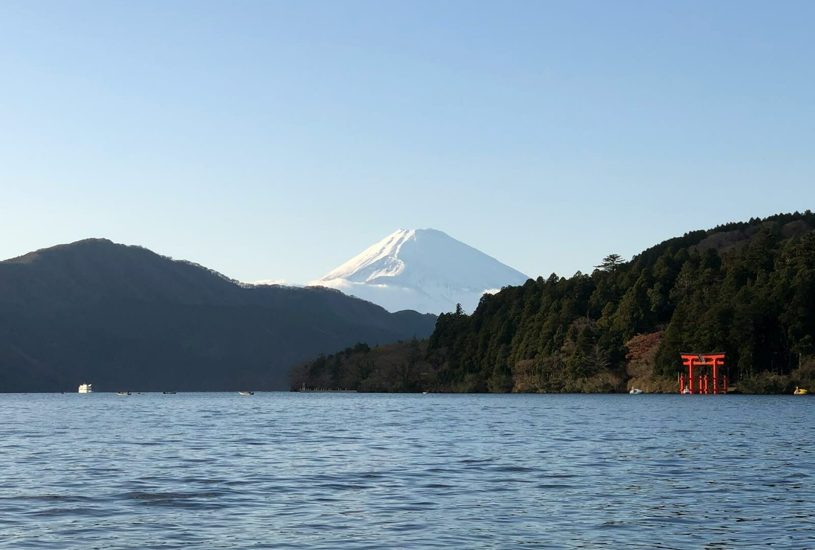 Body of water with mountains at Lake Ashi in Hakone, Kanagawa, Japan
