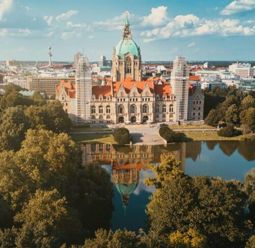 Building near green trees and water in Hanover, Lower Saxony, Germany