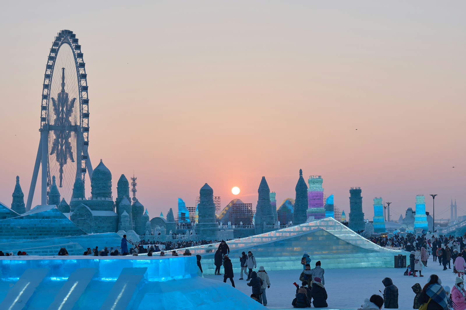 People standing around an ice sculpture in Harbin, Heilongjiang, China