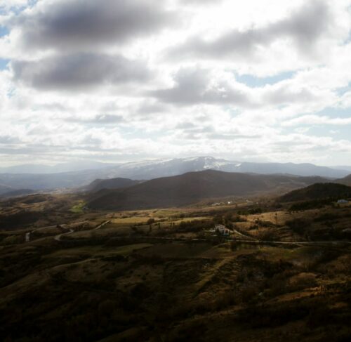 Brown mountains under white clouds in Isernia, Molise, Italy