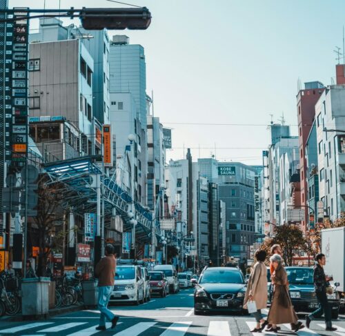 Cars on road between high-rise buildings in Kobe, Hyogo, Japan