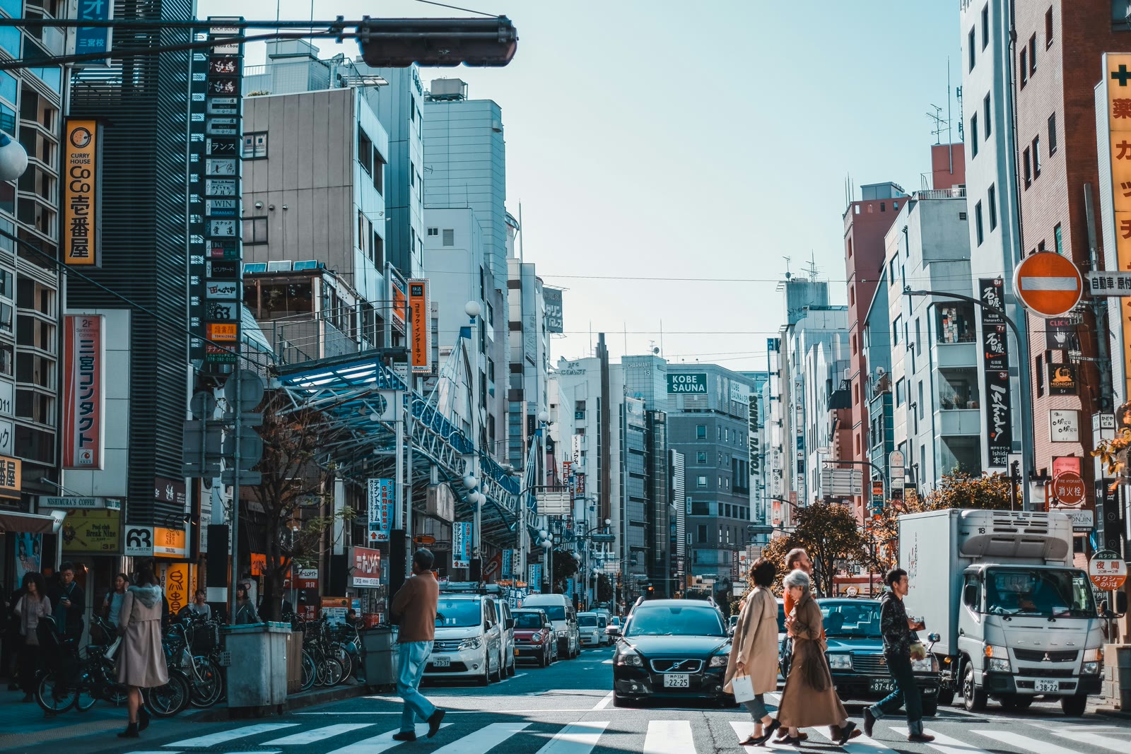 Cars on road between high-rise buildings in Kobe, Hyogo, Japan