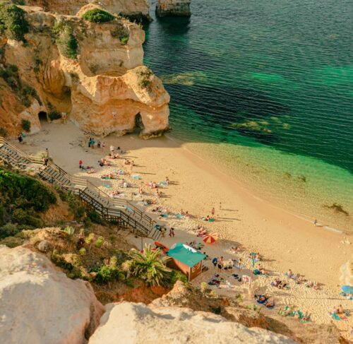 People on the beach during the day in Lagos, Algarve, Portugal
