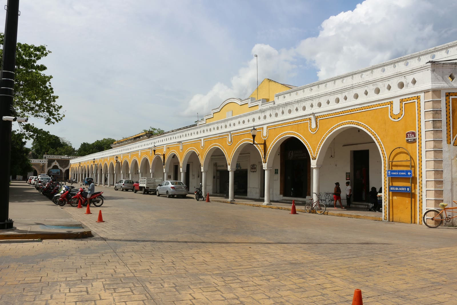 Arched colonial building with parking in Merida, Yucatan, Mexico