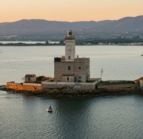 Lighthouse on a small island in the Mediterranean Sea, Olbia, Sardinia, Italy