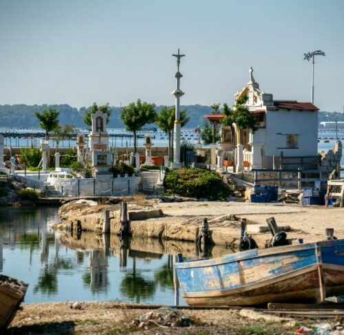 Boats sitting on the water in Taranto, Apulia, Italy