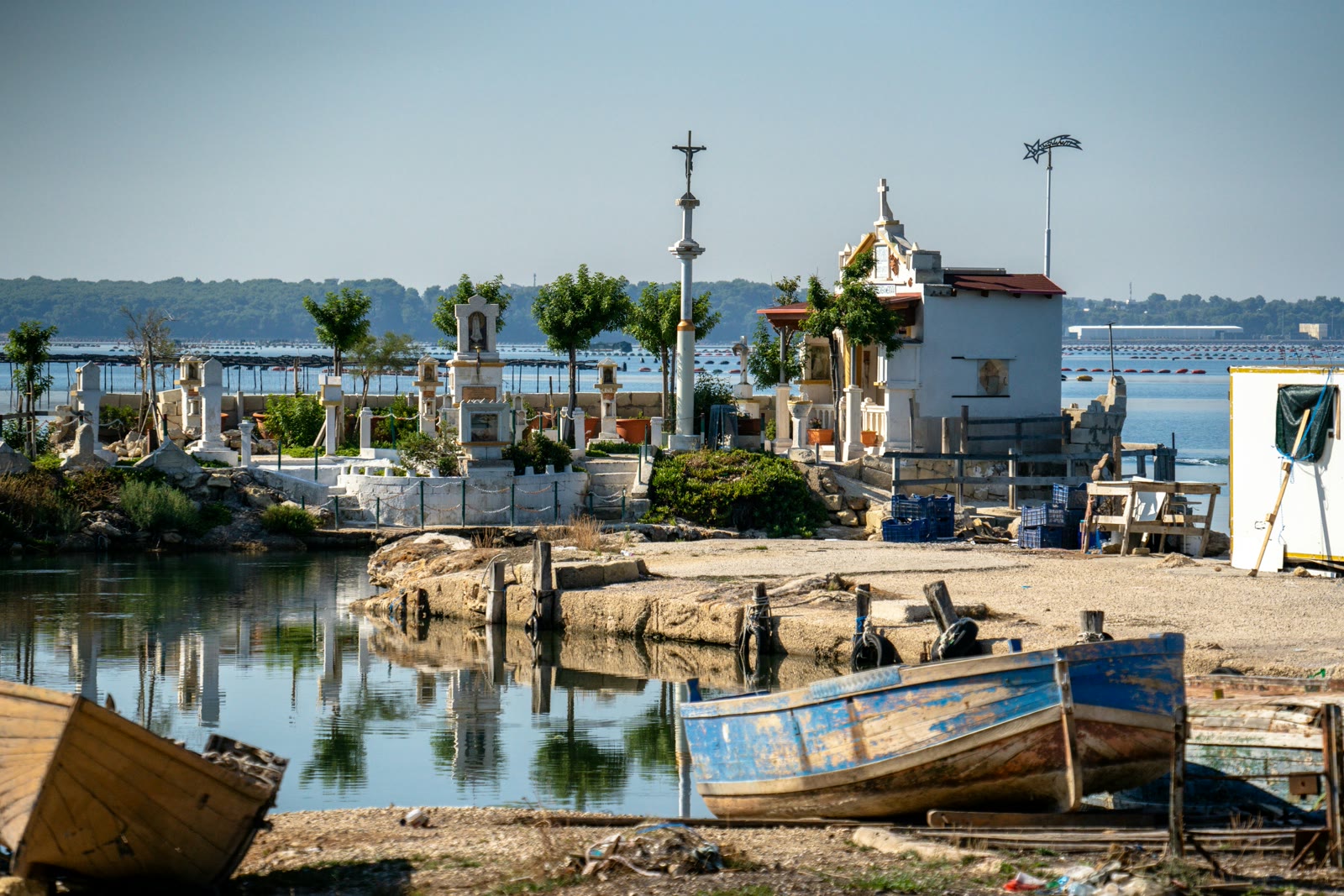 Boats sitting on the water in Taranto, Apulia, Italy