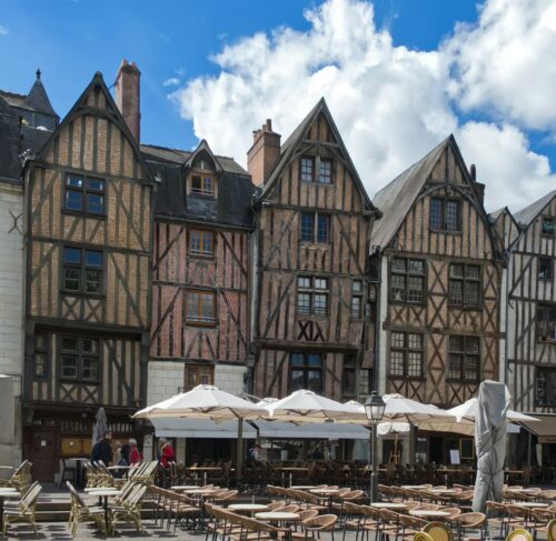 Row of historic buildings with cafe terraces on Place Plumereau, Tours, Centre-Val de Loire, France