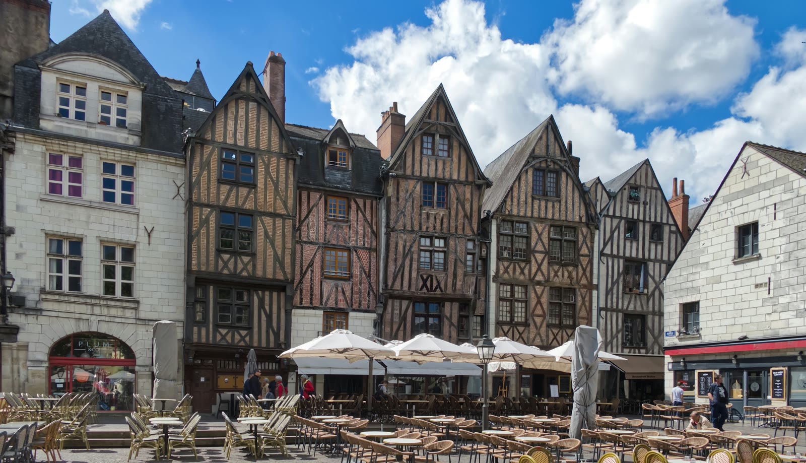 Row of historic buildings with cafe terraces on Place Plumereau, Tours, Centre-Val de Loire, France