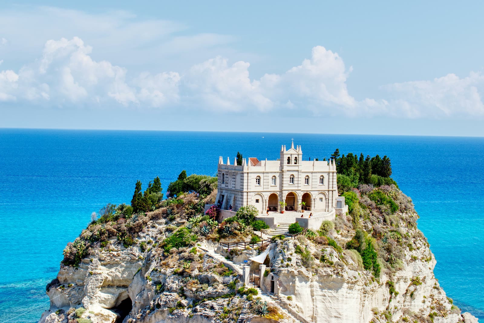 White and brown buildings on cliff near the sea in Tropea, Calabria, Italy