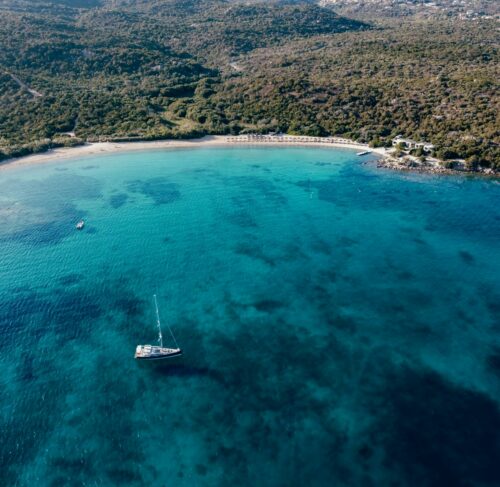Aerial view of a boat on the water in Costa Smeralda, Sardinia, Italy