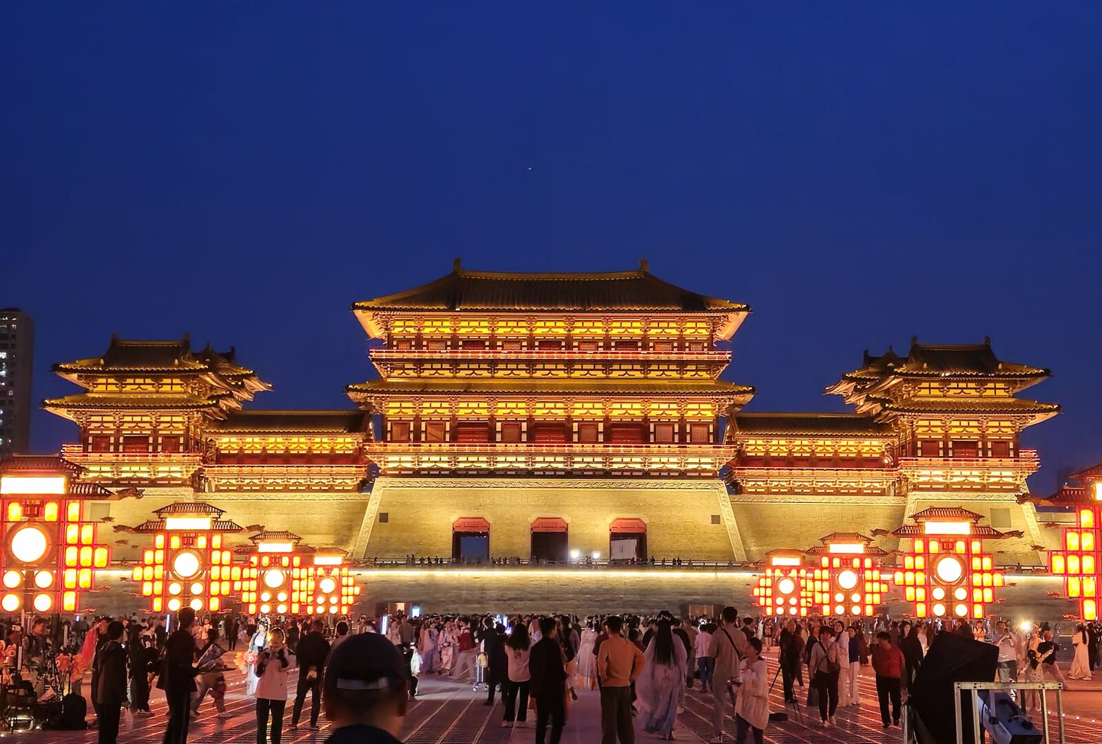 People standing in front of a building in Luoyang, Henan, China