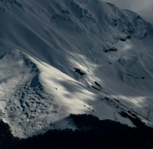 Snowy slope with dramatic shadows in Teramo, Abruzzo, Italy